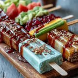 Vibrant Fricy Mango Chamoy Popsicles with Tajin, a refreshing spicy-sweet frozen delight.
