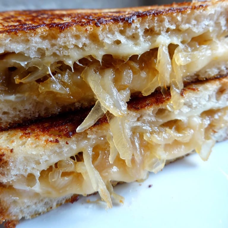 Hearty slices of caramelized onion & Gruyère grilled cheese paired with a simple green salad on the side.