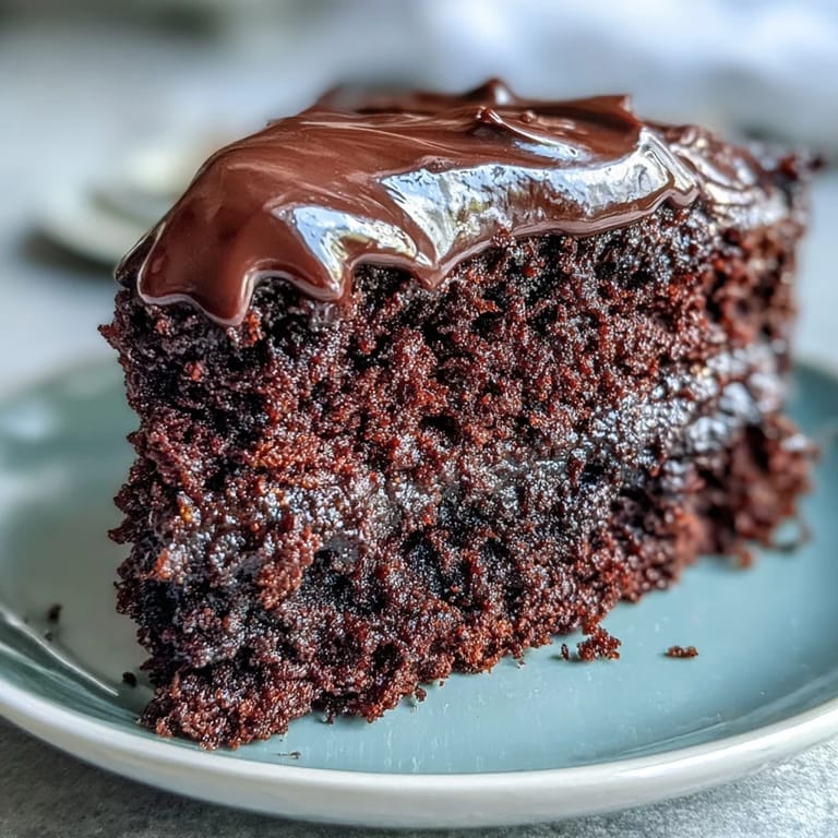 Easy Chocolate Fudge Cake with moist crumb and silky-smooth chocolate icing, ideal for celebrations.