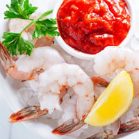 Freshly chilled Shrimp Cocktail with plump shrimp and vibrant red cocktail sauce, ready to serve!