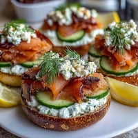 Spring Brunch Smoked Salmon Bagel Board with Cream Cheese, featuring assorted bagels, fresh vegetables, and garnishes for a vibrant, shareable meal.